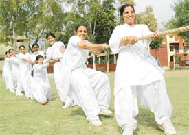 Students take part in a tug-of-war during the annual sports meet at Malwa Central College of Education for Women in Ludhiana on Saturday