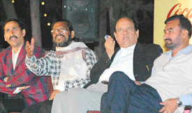 Surender Sharma and other poets during a Hasya Kavi Sammelan at the Leisure Valley, Sector 10, Chandigarh, on Saturday.