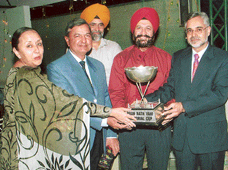 The winners get trophy during the Pran Nath Vahi Memorial Golf tournament held at Golf Club, Chandigarh, on Saturday.
