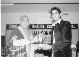 Vibhas Arora of Karnal being honoured by Chief Minister Bhupinder Singh Hooda for his performance in a singing contest last year