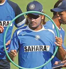 Lord of the Ring:  Mahendra Singh Dhoni takes part in a practice session in Nagpur on Sunday. The first Test between India and England begins on Wednesday.