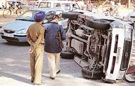 Policemen inspect the Qualis that was involved in a fatal accident near a petrol station in Sector 10, Chandigarh, on Tuesday afternoon