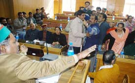 BJP councillors stage a protest at the meeting of the Municipal Corporation in Shimla on Tuesday. The councillors were demanding the resignation of the Mayor.