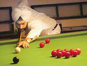 Deepinder Patwalia concentrates during a pre-quarterfinal match of snooker against Navtej Singh in Chandigarh