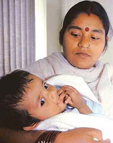 Seven-month-old Rahul with his parents after being discharged from Fortis Hospital in Mohali