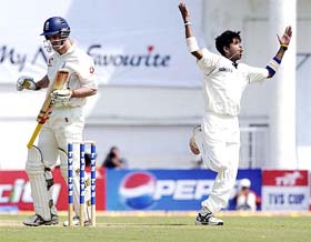 S. Sreesanth celebrates on dismissing Englands Andrew Strauss on the first day of the first Test at the VCA Stadium in Nagpur