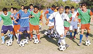 Young footballers hone their skills at the National Football Camp by AIFA at Football Stadium, Sector 17, Chandigarh, on Thursday. 