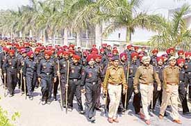 The Chandigarh Police marches on the Panjab University campus in Chandigarh on Thursday. 