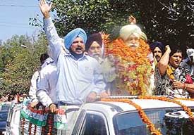 Mr Bir Devinder Singh, MLA from Kharar, with supporters during a rally to celebrate the district status to Mohali, on Thursday. 