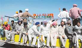 Farmers take a joyride on a trolley to go around stalls at the PAU kisan mela in Ludhiana on Thursday