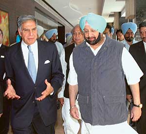Chairman of the Tata Group Ratan Tata underscores a point as he meets Punjab Chief Minister Amarinder Singh in Chandigarh on Friday.