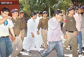 The six students arrested by the city police for their involvement in rioting on the Panjab University campus on Wednesday. The accused are being taken to the Sector 11 police station, Chandigarh