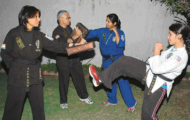 Members of the Kundu family practise choi kwang do in Panchkula