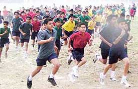 Students take part in inter-state cross-country at YPS in Mohali on Saturday. 