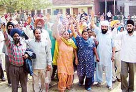 Residents of Phase XI, Mohali, protest against the PSEB authorities on Saturday.