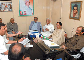 DPCC president Ram Babu Sharma with other leaders during a discussion on the demolition drive at the party office in the Capital on Saturday.