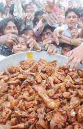A chicken dish being served for free in Ambala on Saturday. 