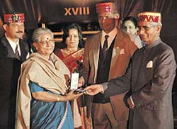 A replica of the Ashok Chakra being presented to the parents of late Major Sandeep Shankla by Lieutenant-General J.K. Mohanty during the silver jubilee function of the 18 Dogra Regiment in Jalandhar Cantonment on Saturday. 