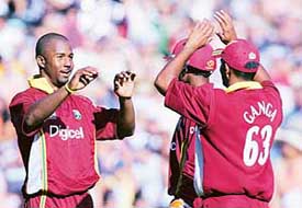Dwayne Smith of the West Indies celebrates with team-mates after dismissing James Franklin of New Zealand during the fifth one-dayer at Eden Park in Auckland on Saturday