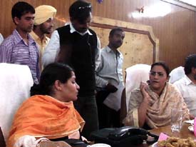 Ms Razia Sultana, Parliamentary Secretary, and Dr Indu, SDM, redress the grievances of people at Mandi Ahmedgarh 