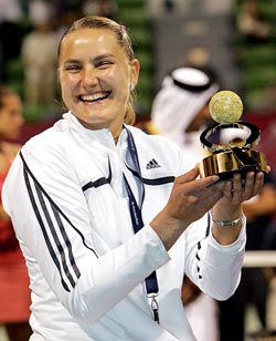 Nadia Petrova of Russia holds the winners trophy after beating Amelie Mauresmo of France in the final of the Qatar Open tennis tournament in Doha on Saturday