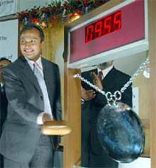 ADAG group Chief Anil Ambani rings the ceremonial bell at the Bombay Stock Exchange
