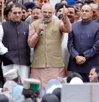 Senior BJP leader Sahib Singh Verma addresses a gathering in front of Vidhan Sabha in Shimla on Monday. Also seen in the picture are state BJP chief Suresh Bhardwaj