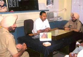 DIG Patiala B.K. Bhamwra addresses a meeting of police officials at Mandi Ahmedgarh police station on Monday