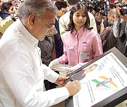 Haryana Chief Minister Bhupinder Singh Hooda signs a plaque at the inauguration of a Samsung mobile phone plant in Manesar, Haryana. The plant has the capacity to produce 1 million handsets per year and has been built at an investment of $15 million. 