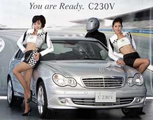 Models pose next to Mercedes Benzs C 230V sedan unveiled at Grand Hyatt Hotel in Seoul, South Korea, on Tuesday. The price of the sedan, equipped with a 2,496 cc engine, is 56.9 million won ($58,263).