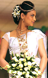 A model displays a wedding creation at a Bridal Fair in Colombo on Friday. The 10th annual bridal show, organised by the Sri Lanka Exhibition and Convention Centre, runs until Sunday
