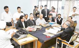 Mr A.K. Singla, Presiding Officer of the Labour Court, hears cases during a labour lok adalat at District Courts Complex in Ludhiana on Friday
