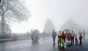 People enjoy the weather in Shimla on Saturday.