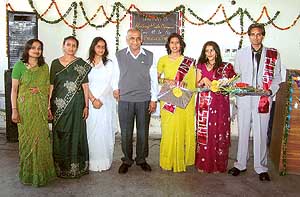 Dr A.N. Garg, Principal, Government College, Sector 46, with the students who were rewarded for their performance in dance, songs and skits in Chandigarh on Sunday.