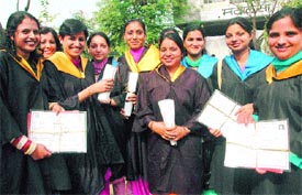 Students of Hindu Kanya College holding their degrees after the annual convocation in Kapurthala on Sunday