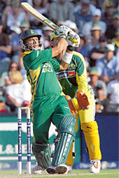 South Africas Herschelle Gibbs hits a four during the fifth one-dayer against Australia in Johannesburg on Sunday.