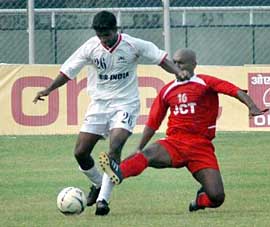 Air-Indias Soccor Velho (left) tries to get past JCTs Marcos Pereira during a National Football League match at Guru Nanak Stadium in Ludhiana on Sunday. JCT won 2-1.