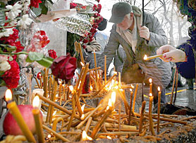 Supporters of Slobodan Milosevic light candles in memory of the ex-Yugoslav leader in front of Serbian Social Party headquarters in Belgrade on Sunday.