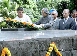 President A.P.J. Abdul Kalam is watched by officials including the Prime Minister of Mauritius Navinchandra Ramgoolam (second from right) as he lays a wreath at the memorial to former Mauritian Prime Minister Sir Seewoosagur Ramgoolam in Port Louis on Sunday.