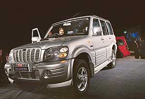 Mr Anand Mahindra, Vice-Chairman and Managing Director of Mahindra & Mahindra Ltd, sits in a new variant of Scorpio in Nasik, 160 km from Mumbai, on Monday. The price of the new variant, available in three models, would range between Rs 7,31,800 and Rs 8,52,300. M&M plans to invest Rs 100 crore to expand its plant to feed an auto market set for double-digit growth next fiscal.