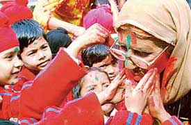 Students of Ashmah International School celebrate Holi with inmates of Old-age home, Sector 15, Chandigarh, on Monday