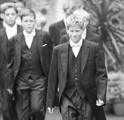 Britains Prince Harry leads his classmates from their dormitory to begin their first day of lessons at Eton in Windsor, south England