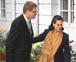 Congress Party President Sonia Gandhi escorts Finland's Prime Minister Matti Vanhanen before their meeting in New Delhi