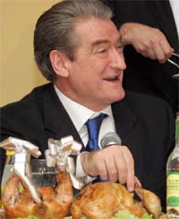 Albanian Prime Minister Sali Berisha is pictured during a lunch to promote the chicken industry in Tirana, Albania