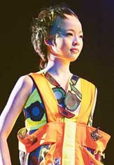 A model presents a latest hairdo during "Hair Coloring Splash, 2006, in Tokyo on Tuesday. 