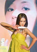 Taiwanese model Lin Chih-ling promotes an international shampoo brand in Taipei on Tuesday. 