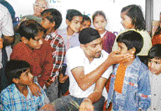 Harbhajan Singh celebrates Holi with slum kids from Durga Das Foundations Night School in Chandigarh on Tuesday.