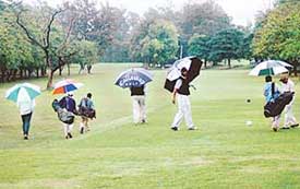 The inclement weather fails to dampen the spirit of these golfers who set out on the greens with all bag and baggage at the Chandigarh Golf Club on Tuesday.