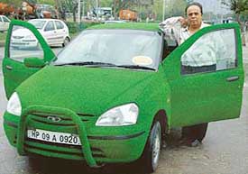  Mr Ramesh Dudhani with his green car in Chandigarh on Tuesday.