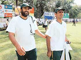Pakistan captain Inzaman-ul-Haq and Abdul Razzaq leave the cricket ground without completing their first practice session as the ground was occupied for a soft ball match in Colombo on Tuesday